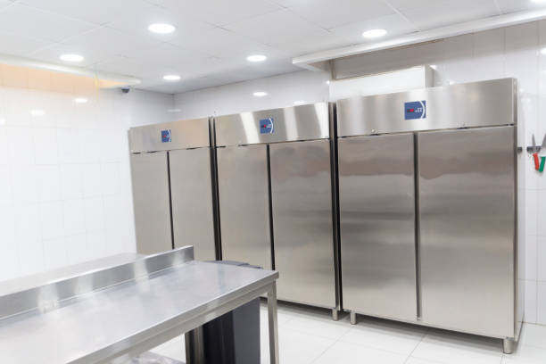 Commercial refrigerators lined up for responsible recycling and eco-friendly disposal.