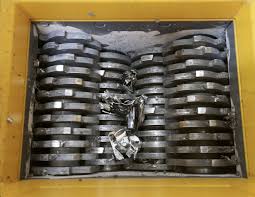 Hard drive being shredded as part of our UK secure data destruction and IT disposal service