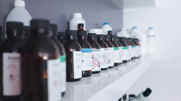 Various laboratory chemical bottles and containers ready for safe disposal and recycling.