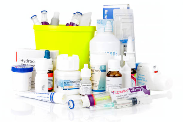 A mix of pharmaceutical waste including tablets, packaging, bottles, and medical products for disposal in the UK