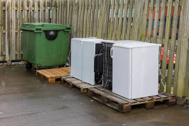 Used refrigerators and freezers awaiting responsible recycling and disposal.