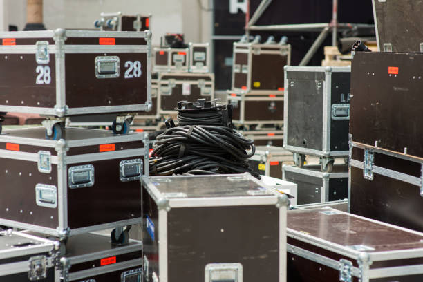 Boxes of stage and AV equipment during mobile stage setup, representing items for disposal or recycling.