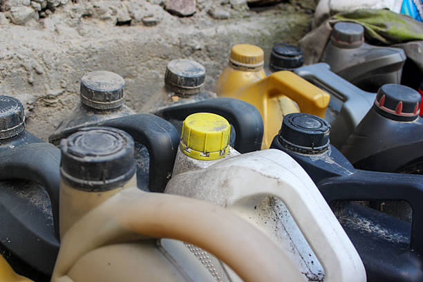 Containers of used oil prepared for collection, recycling, and environmentally safe disposal.